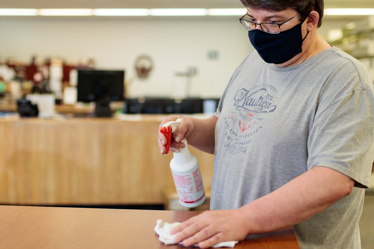 Roger Getz disinfects surfaces at the CIL