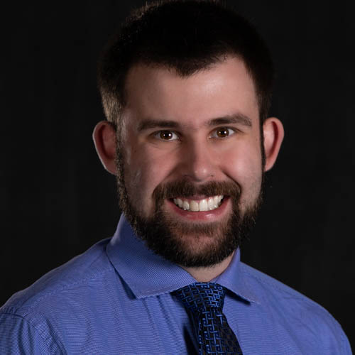 Headshot of Alec Brooks.