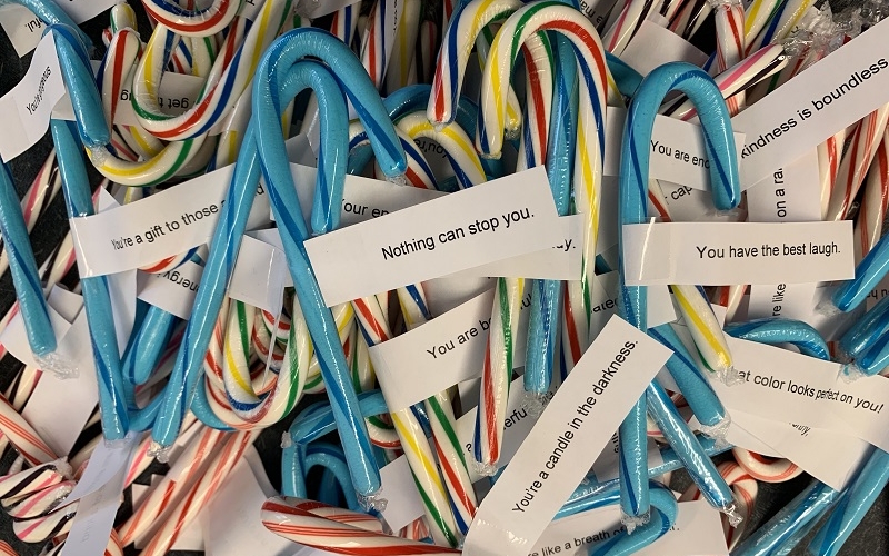 Students pass out OneLove candy canes