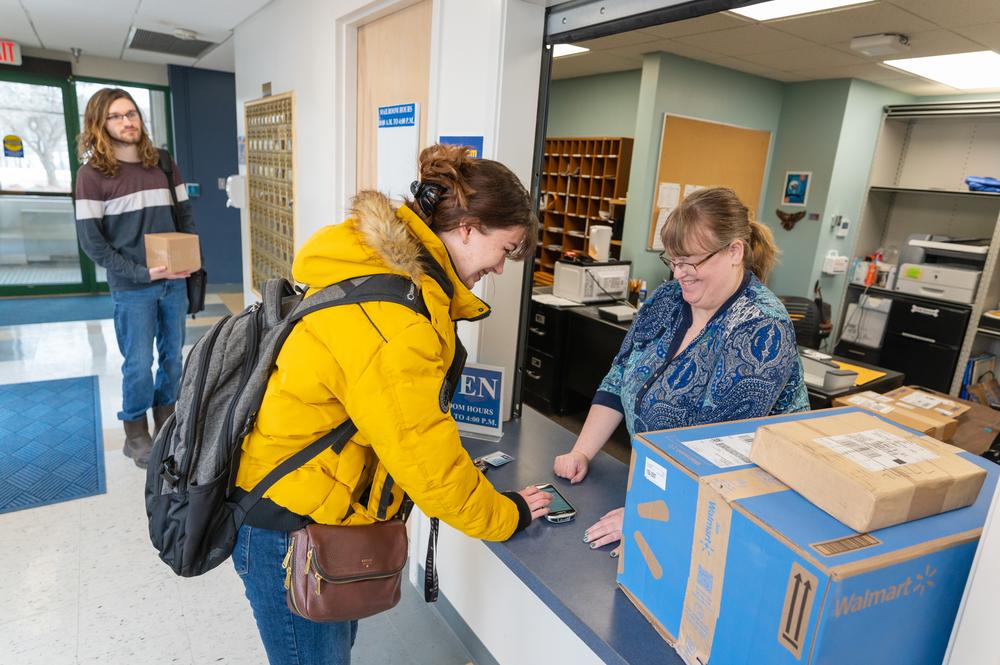 UMPI student picking up mail from mailroom