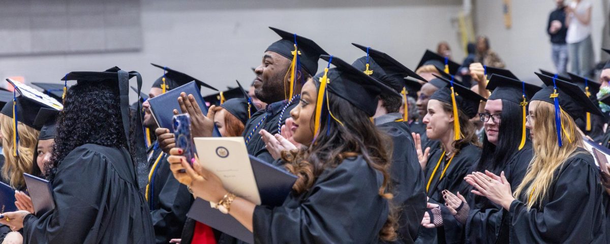 UMPI students clapping at commencement.