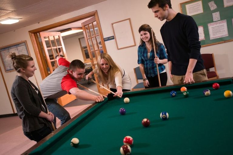Students playing pool in the Park Hall lounge